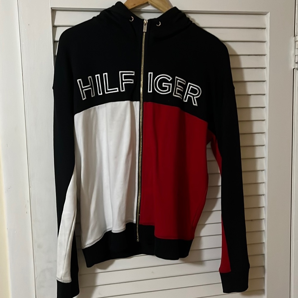 Size L Tommy Hilfiger black, red, and white zip up hoodie.